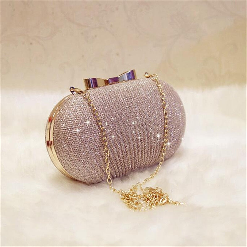 Pochette Héliodore Pervenche Paris – soirée dorée